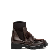 Stivaletto in pelle e cavallino con traversino.