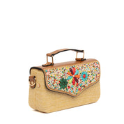 Borsa a mano clutch in rafia con applicazioni