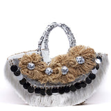 Borsa Capri in paglia con applicazioni.