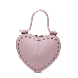 Borsa in ecopelle a cuore rosa.