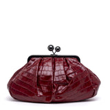 Borsa pasticcino in rosso rubino con stampa cocco.