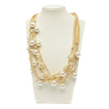 Collana multifili dorata con perle.