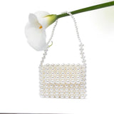 Mini pochette in perle avorio.