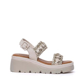 Sandalo beige/platino con zeppa.