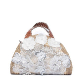 Shopper a mano in rafia con applicazioni floreali
