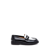 Black and white abrasive moccasin.