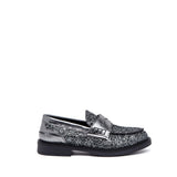 Mocassino in glitterone con riporti laminati.