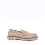 Nude moccasin with accessory.