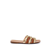 Mule in nappa con borchie.