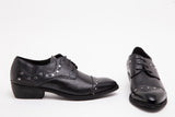 Scarpa bassa in pelle nera stampa vipera.