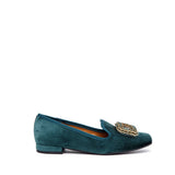 Green velvet slippers.